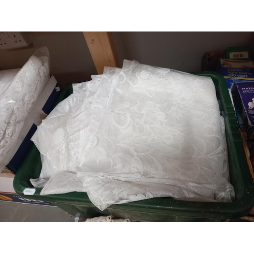 144 - A quantity of lace curtains etc (3 boxes)