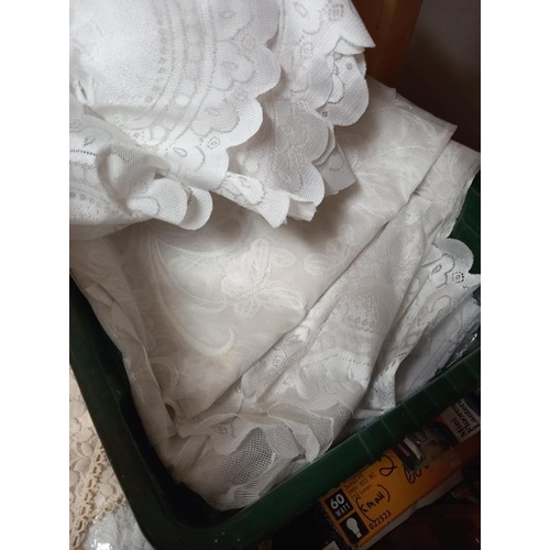 144 - A quantity of lace curtains etc (3 boxes)