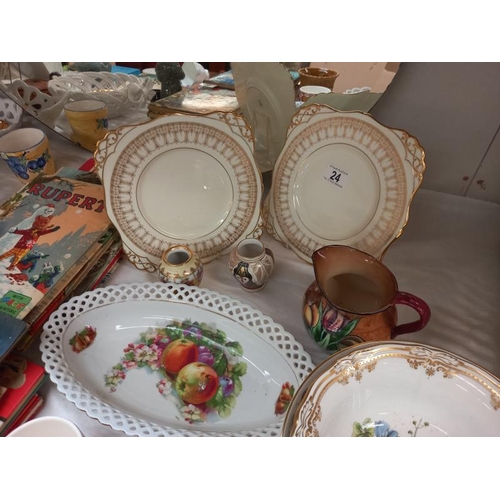 24 - A quantity of interesting china including jugs, bowls & plates