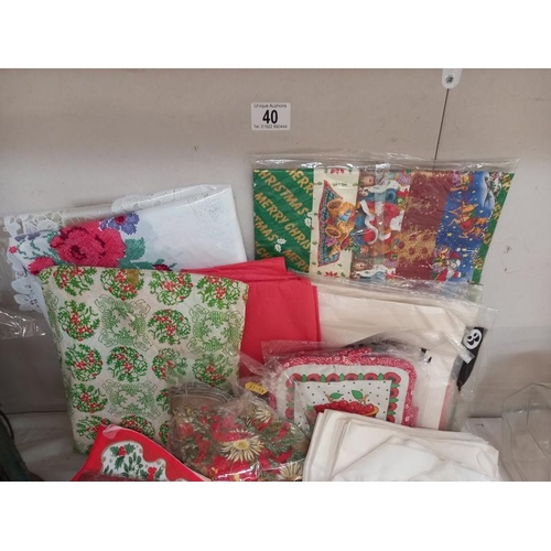 40 - A mixed lot of napkins, handkerchiefs, Xmas gift wrap, table mats etc.