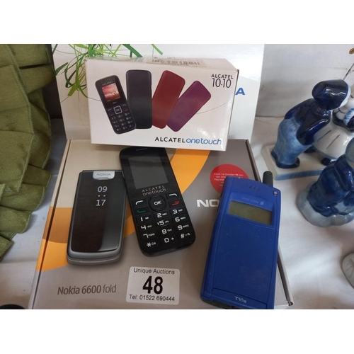 48 - An assortment of mobile phones