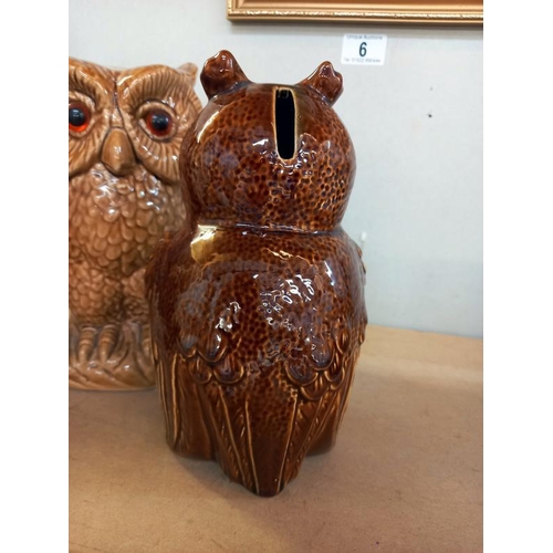 5 - A pottery owl money box and an owl figure height 20.5cm and 22.5cm