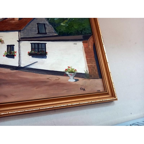 6 - A painting on board of cottages signed EAB 1986