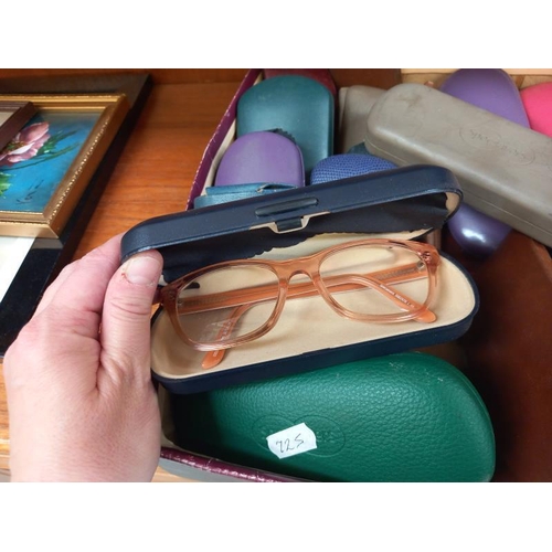 89 - A box of spectacle cases including some with glasses