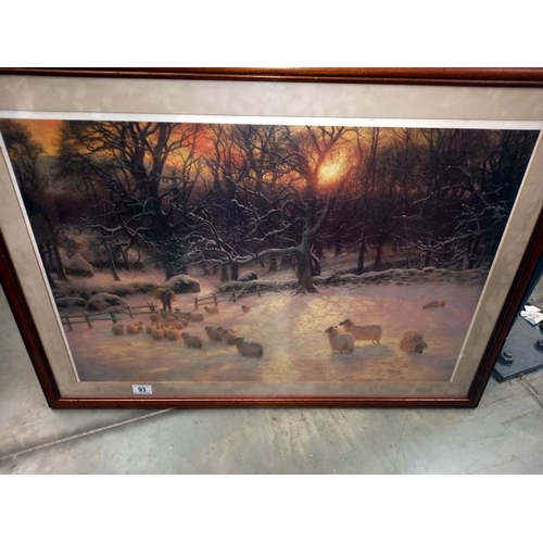 93 - A framed and glazed print of a winter scene with sheep. COLLECT ONLY.