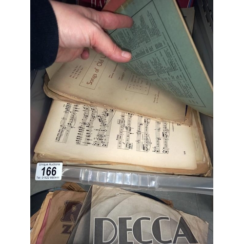 166 - A few 78's and some sheet music.