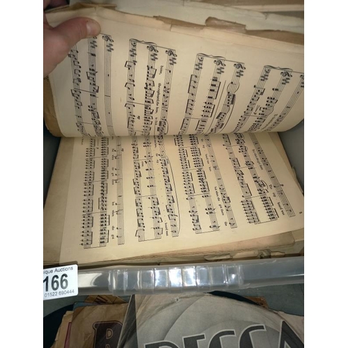 166 - A few 78's and some sheet music.