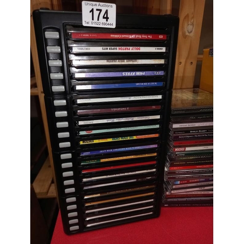 174 - Some CD's with storage drawer chest and stacking pyramids