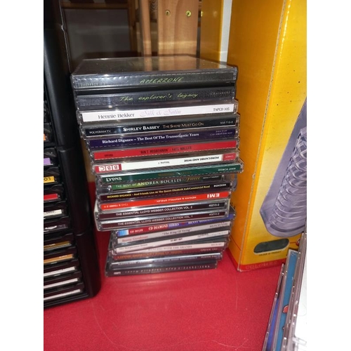 174 - Some CD's with storage drawer chest and stacking pyramids