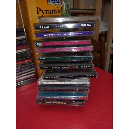 174 - Some CD's with storage drawer chest and stacking pyramids