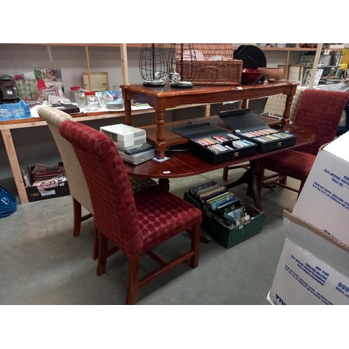 177 - An oval extending twin pedestal dining table with four upholstered dining chairs. COLLECT ONLY.