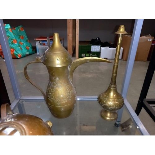 192 - A number of brass and copper ornaments, mini divers helmet, Arabic style jug etc