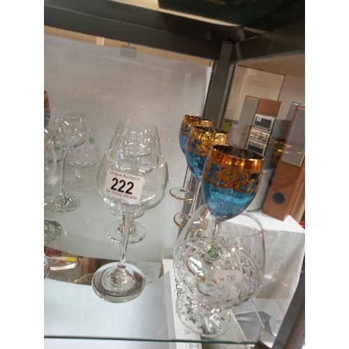 222 - A quantity of boxed drinking glasses including wine and brandy glasses