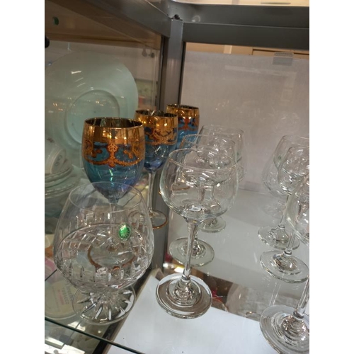 222 - A quantity of boxed drinking glasses including wine and brandy glasses