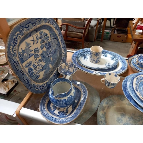 225 - A selection of old & new blue & white porcelain including meat platters, plates, bowls, jugs & cups ... 