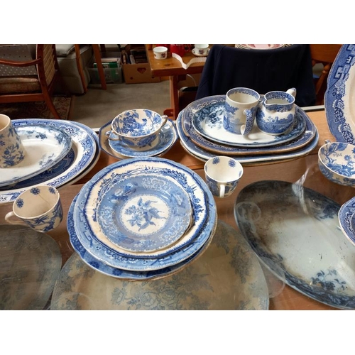 225 - A selection of old & new blue & white porcelain including meat platters, plates, bowls, jugs & cups ... 