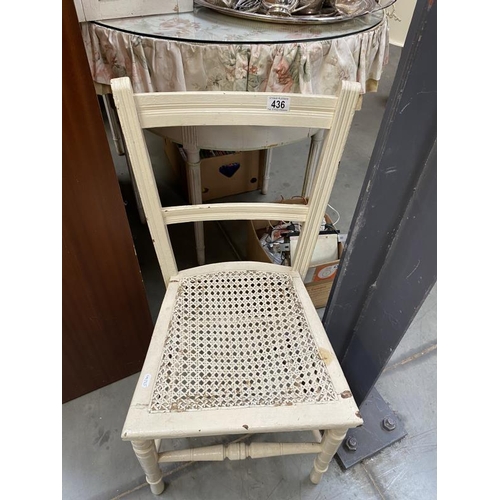 436 - A white ladder back kitchen chair with bergere seat