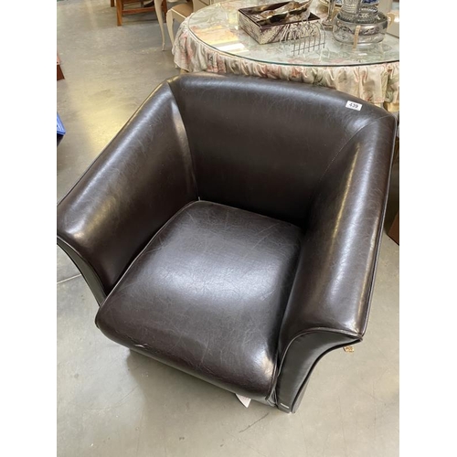 439 - A faux leather armchair