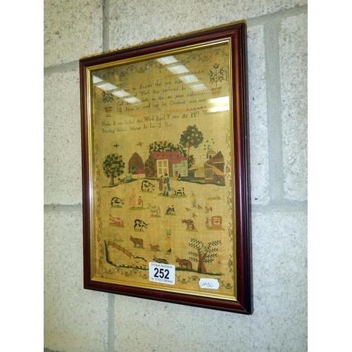 252 - A framed and glazed print of a sampler.