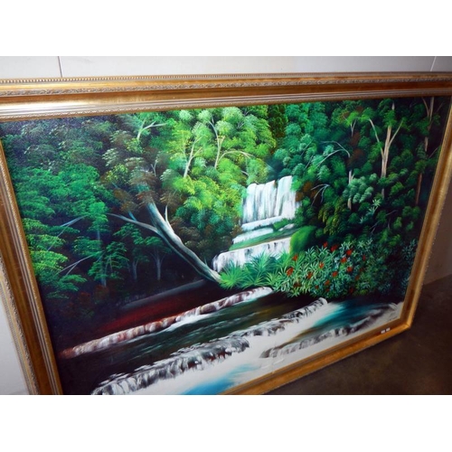 292 - A large oil on canvas painting of a tropical waterfall, 165 x 118 cm.  COLLECT ONLY.