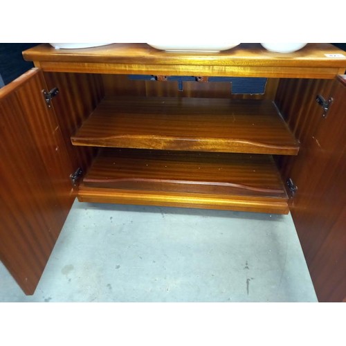 421 - A low 2 door cabinet or TV stand by J Sakol, 78cm wide x 48cm deep x 56 cm tall, COLLECT ONLY.