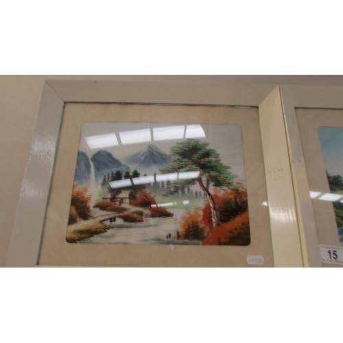 15 - Three framed and glazed mountain scenes on silk.