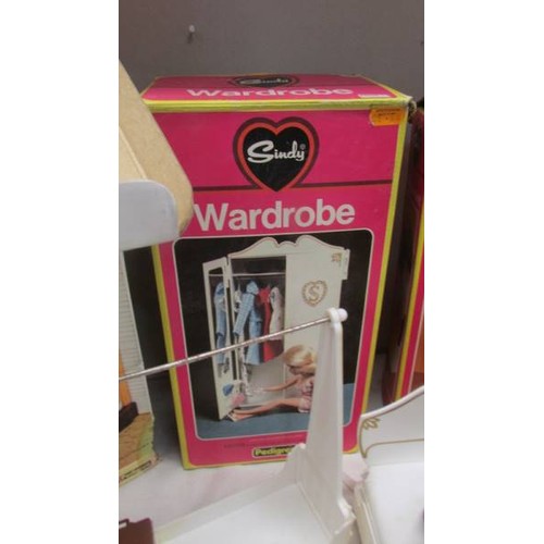 41 - Four boxed Sindy items - shower (iwo), wardrobe, magic cooker (iwo) and other Sindy items including ... 