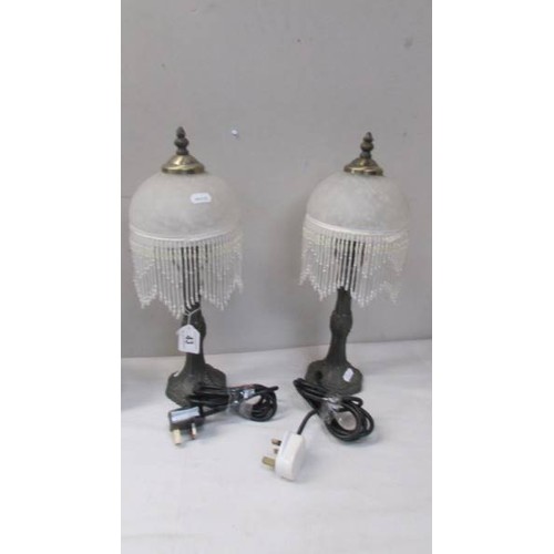 43 - A pair of table lamps with beaded shades.