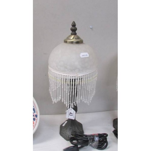 43 - A pair of table lamps with beaded shades.