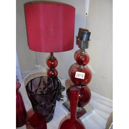 2010 - A mixed lot of red glass including a pair of table lamps. COLLECT ONLY.