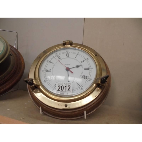 2012 - A cased brass quartz ship's clock.
