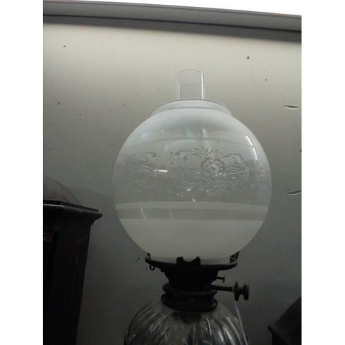 2021 - A brass oil lamp with later etched glass shade. COLLECT ONLY.