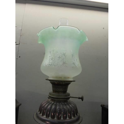 2023 - A brass oil lamp with later etched glass shade. COLLECT ONLY.