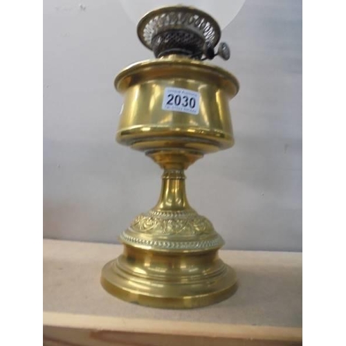 2030 - A brass oil lamp with later etched glass shade. COLLECT ONLY.