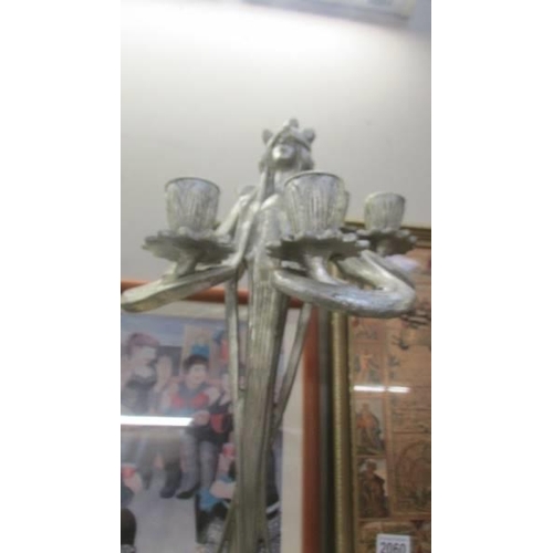 2065 - A pair of silver coloured art nouveau style candelabra.