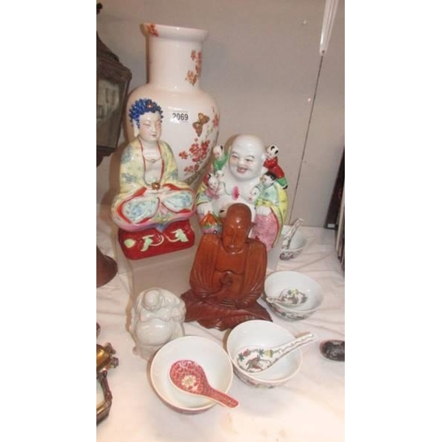 2069 - Three Buddha figures, an large Chinese vase, rice bowls and spoons.