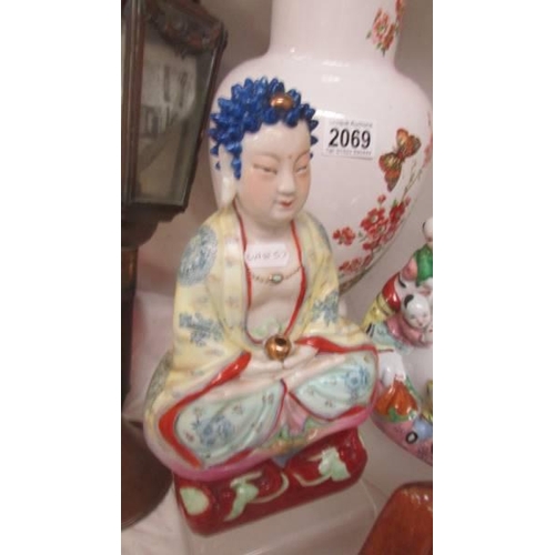 2069 - Three Buddha figures, an large Chinese vase, rice bowls and spoons.