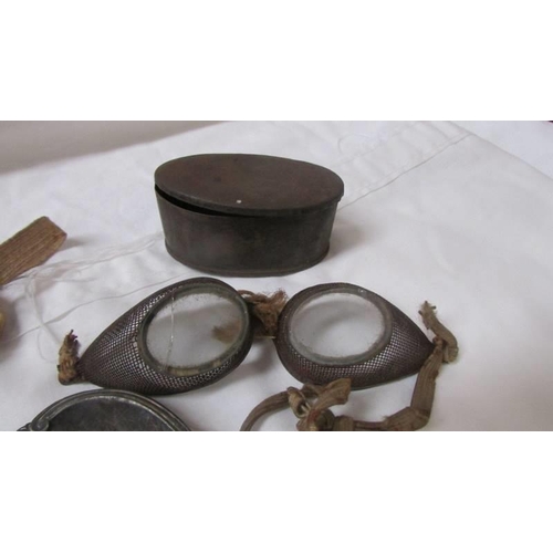 2098 - Three metal trays depicting scenes of Bolton and 2 pairs of vintage goggles.