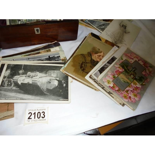 2103 - A mixed lot of old postcards and photographs in a mahogany box.