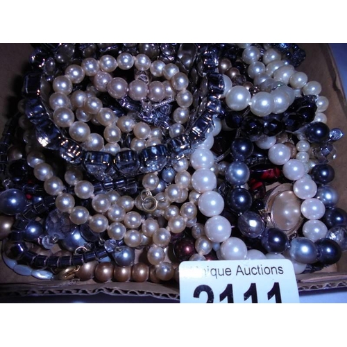 2111 - A mixed lot of bracelets, necklaces etc.,