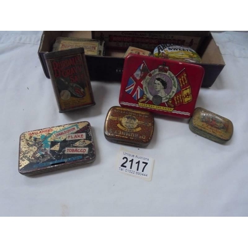 2117 - A mixed lot of tins including Harlequin tobacco, Burdall's gravy salt etc.,