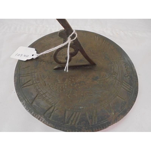 2137 - An old brass sundial.