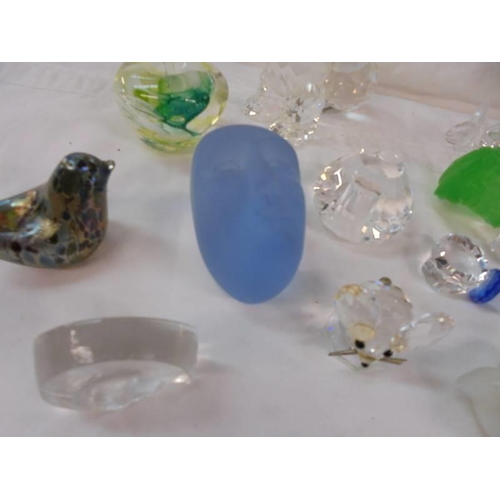 2146 - A mixed lot of glass paperweights, stoppers etc.,