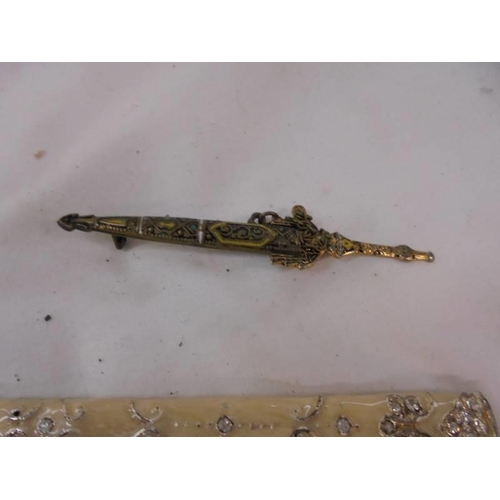 2150 - An ornate letter opener and an a/f sword brooch.