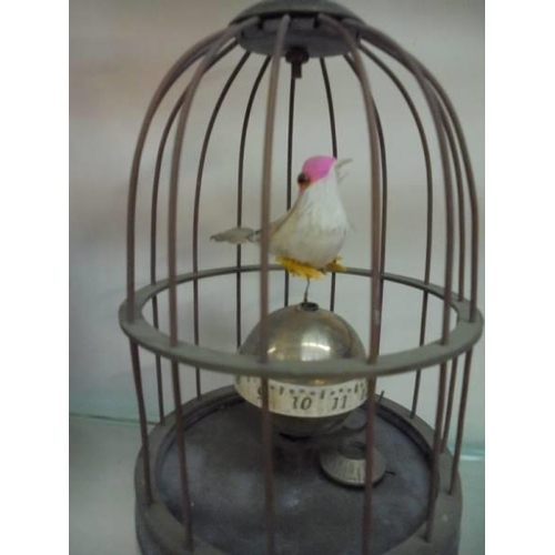 2159 - A singing bird in cage clock.