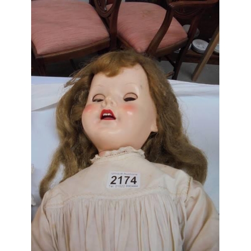 2174 - A vintage walking doll.