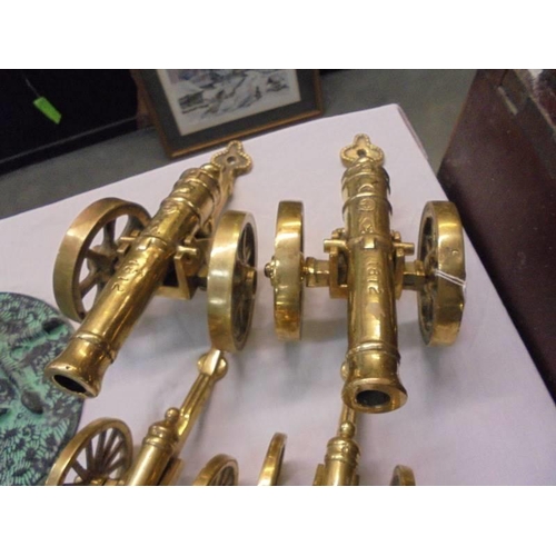 2182 - Two pairs of solid brass cannons.