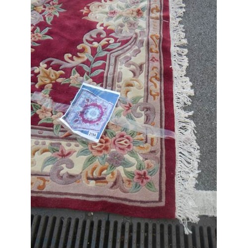 2194 - A red ground rug.