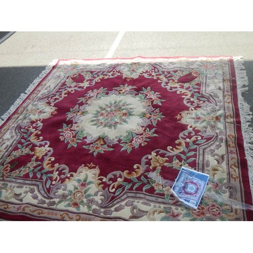 2194 - A red ground rug.