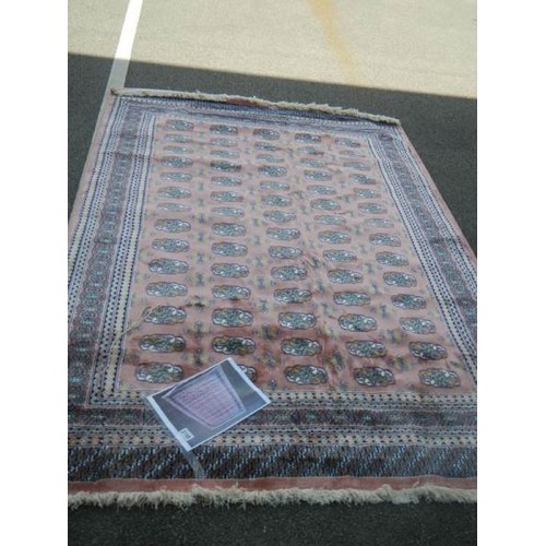 2198 - A pink patterned rug.